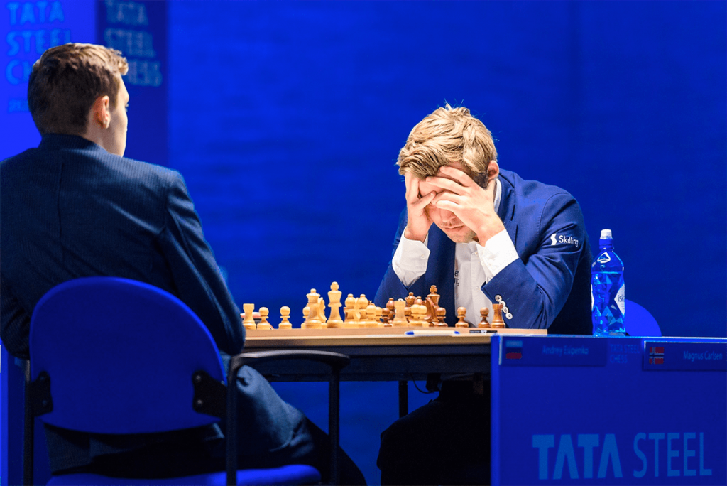 Chess World Champion Magnus Carlsen suffers upset at hands of 18-year-old prodigy Andrey Esipenko