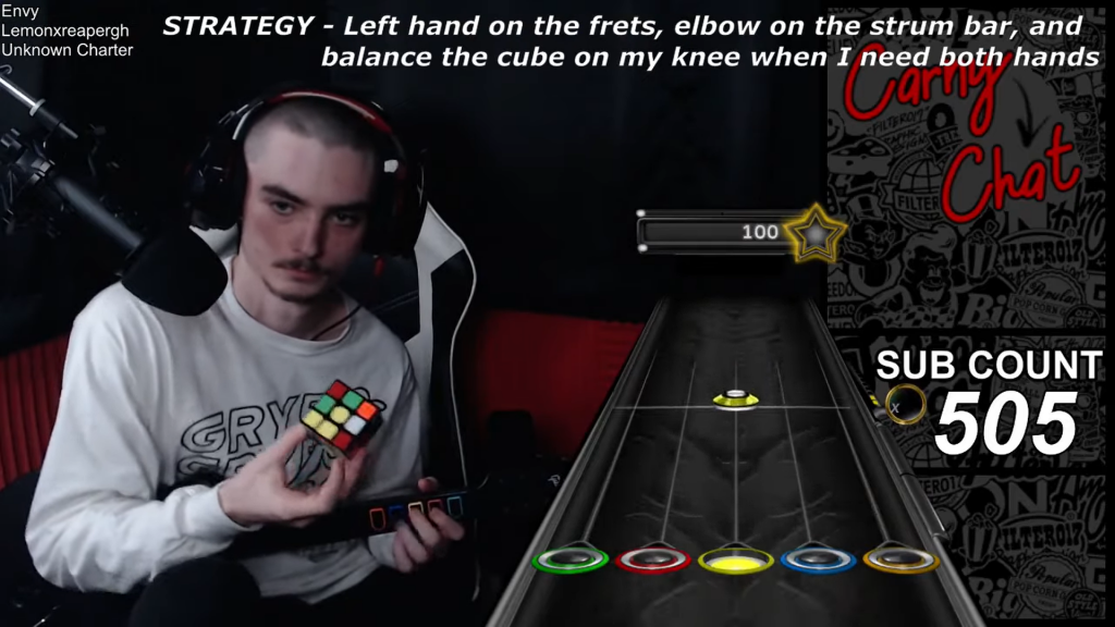 Der Twitch-Streamer Full Combos spielt einen der härtesten Songs von Guitar Hero, während er einen Zauberwürfel löst